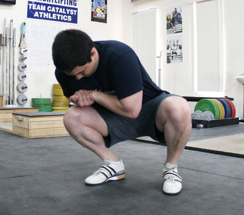 squatting ankle stretch